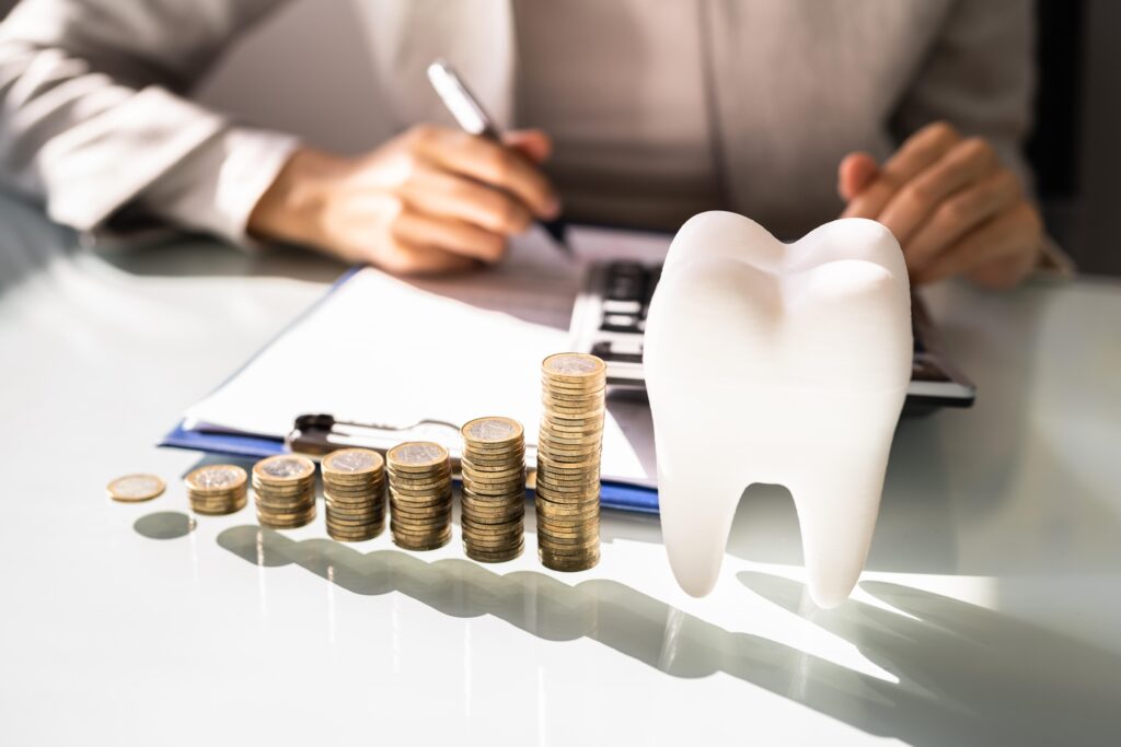 An image indicating affordable dental care, where a woman is calculating her dental costs